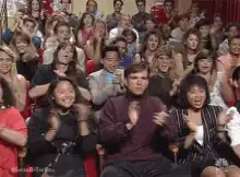 Audience clapping enthusiastically