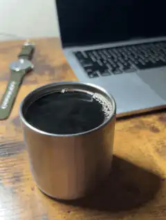 steaming metal cup on desk