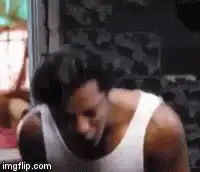 Man in white tank top dancing