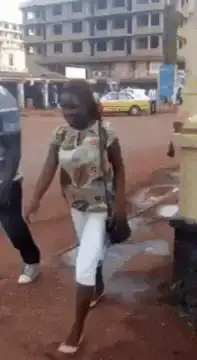 Woman and man walking on street