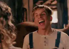 Blonde man laughing hysterically