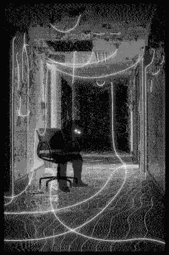 Person sitting in a hallway with glowing light trails