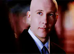 Michael Rosenbaum smirking