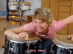 Woman playing tiny bongos