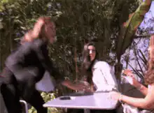 Woman throws plate at another woman