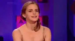 Emma Watson surprised and smiling