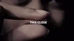 Fingers held close with text