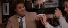 Seinfeld Kramer holds up a cigarette