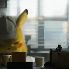 Detective Pikachu drinking coffee