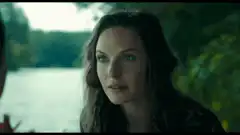 Rebecca Ferguson smiling by the lake