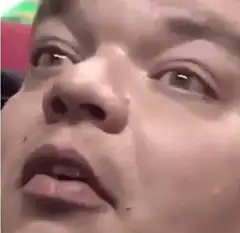 Man's face transitions from shock to laughter