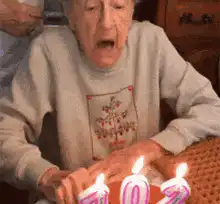 102 year old woman blows out candles