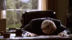 Donald Trump faceplant on desk