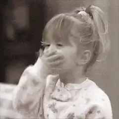 Toddler laughing and pointing