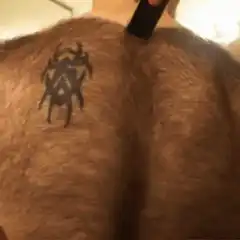 Man shaves stripes on hairy back