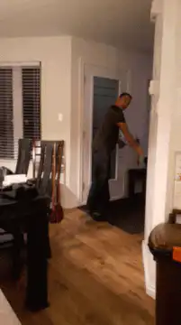 Man opens door and smiles