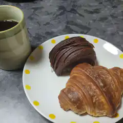 croissant and chocolate pastry with coffee