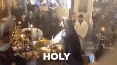Woman splashing water at church