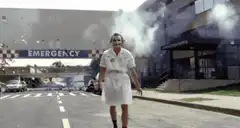 Joker in a nurse outfit walking towards camera