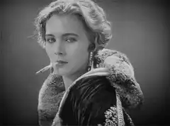 Vintage woman smoking with fur stole