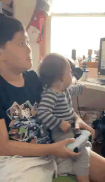 Baby turns to camera with a serious face