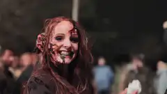 Zombie woman gives thumbs up