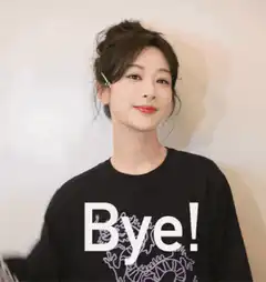 Woman waving goodbye in black shirt