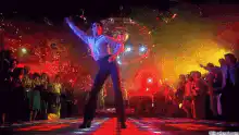 John Travolta dancing on stage