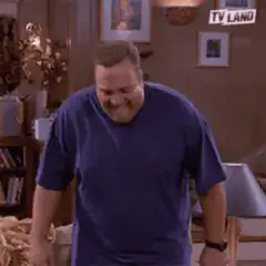 Larry the Cable Guy sits on couch laughing