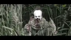 Pennywise the Dancing Clown in the grass
