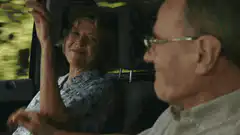 Couple laughing in car