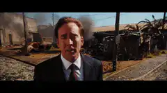 Nicolas Cage smoking in front of burning train