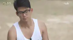 Man in glasses closes eyes