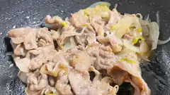 sliced pork and cabbage stir-fry in pan