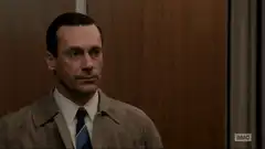 Don Draper peeking from behind a door