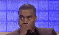 Kanye West hand over mouth