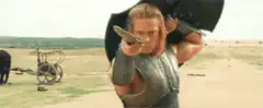 Brad Pitt as Achilles pointing sword