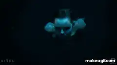 Siren mermaid and man underwater