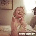 Toddler laughing on the phone