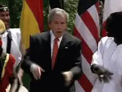 George W. Bush dancing with flags