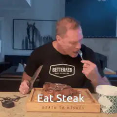 Man eating steak with fork and knife