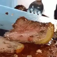 Cutting juicy medium rare steak