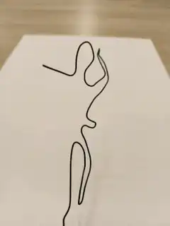 Continuous line drawing of a dancing figure