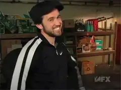 Man in tracksuit gives thumbs up