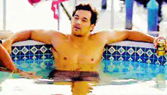 Ben Affleck relaxing in a pool with a beer