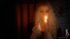 Woman lighting a candle