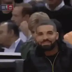 Drake pointing and smiling