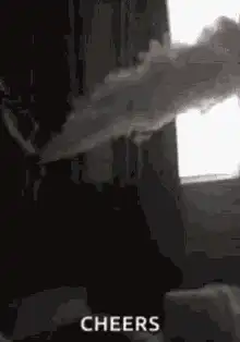 person blowing smoke cheers