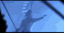 Silhouette dancing on a swing