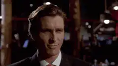 Gordon Gekko smirking and smiling